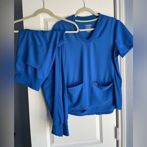 Landau Forward women’s stretchy scrubs with cargo jogger pants.